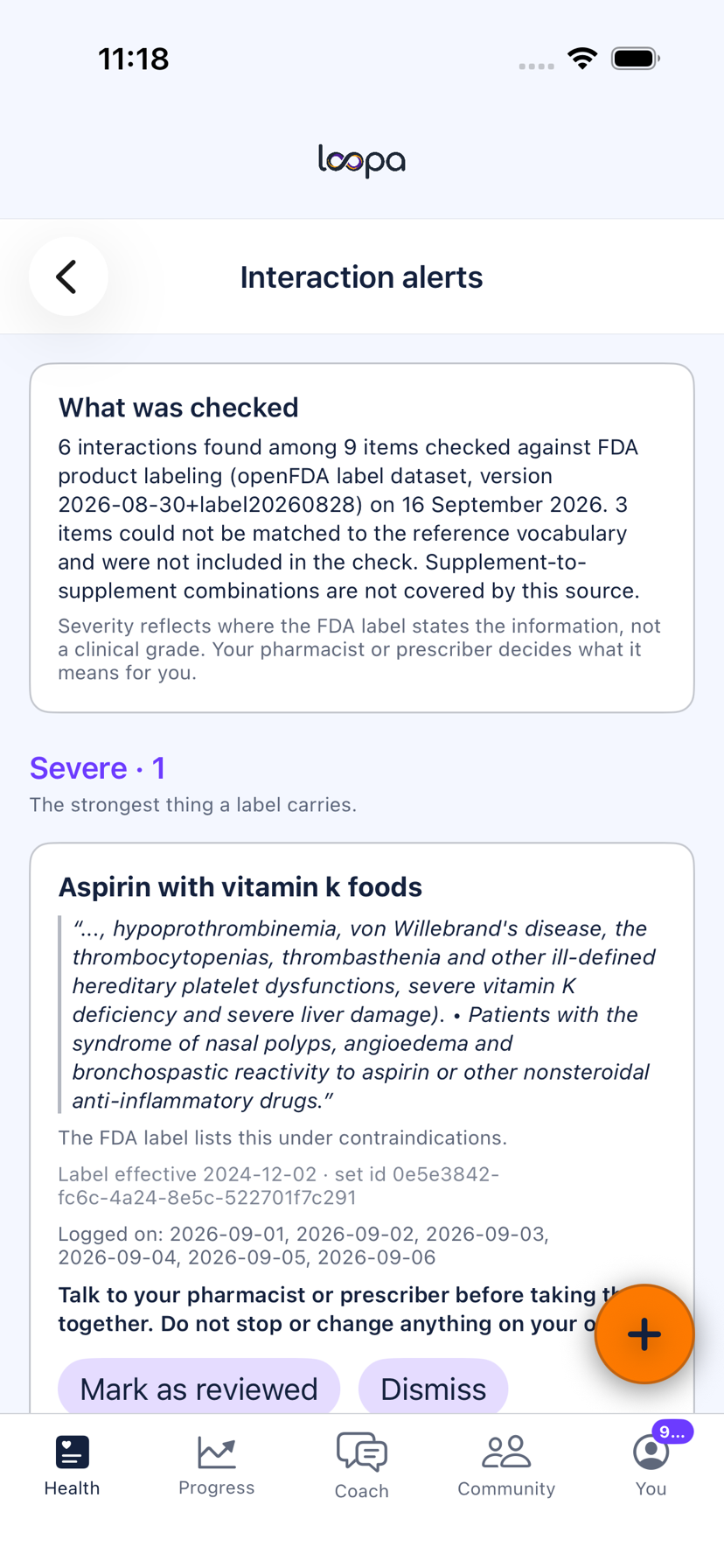 An interaction alert in Loopa on iPhone, quoting the FDA label sentence with its section, effective date and label identifier, above a line directing the member to their pharmacist